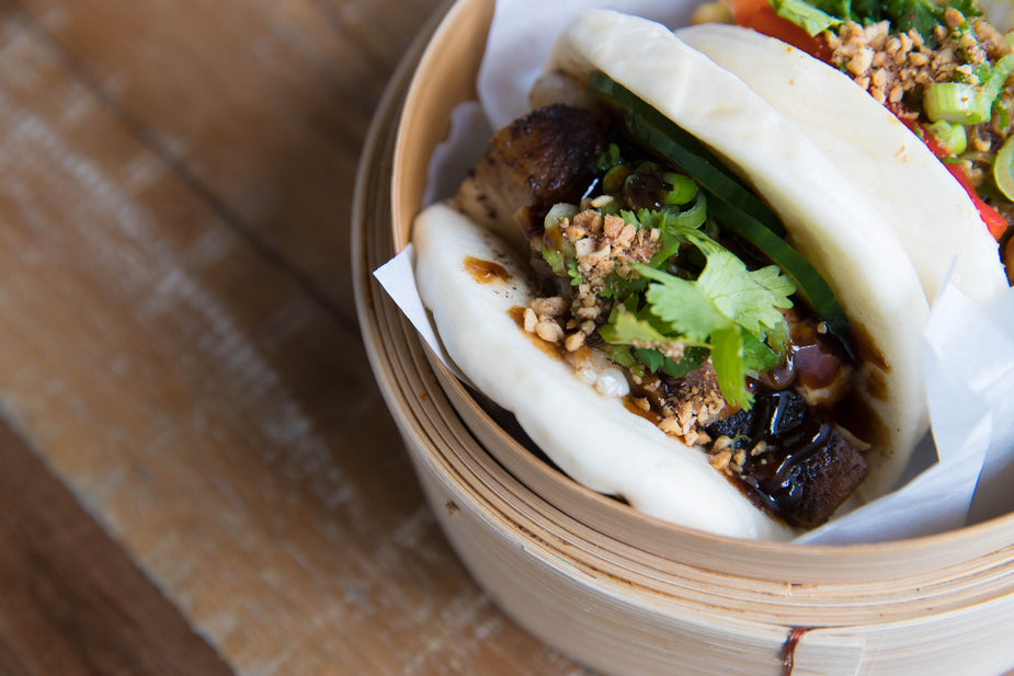 close-up-of-a-bao-bun-on-a-wooden-table.jpg